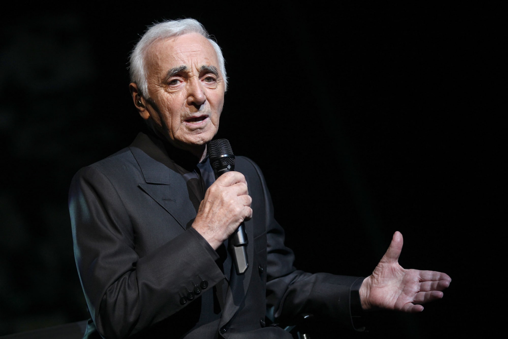 (FILES) In this file photo taken on September 7, 2011 French singer-songwriter Charles Aznavour performs on stage at the Olympia concert hall in Paris in Paris.