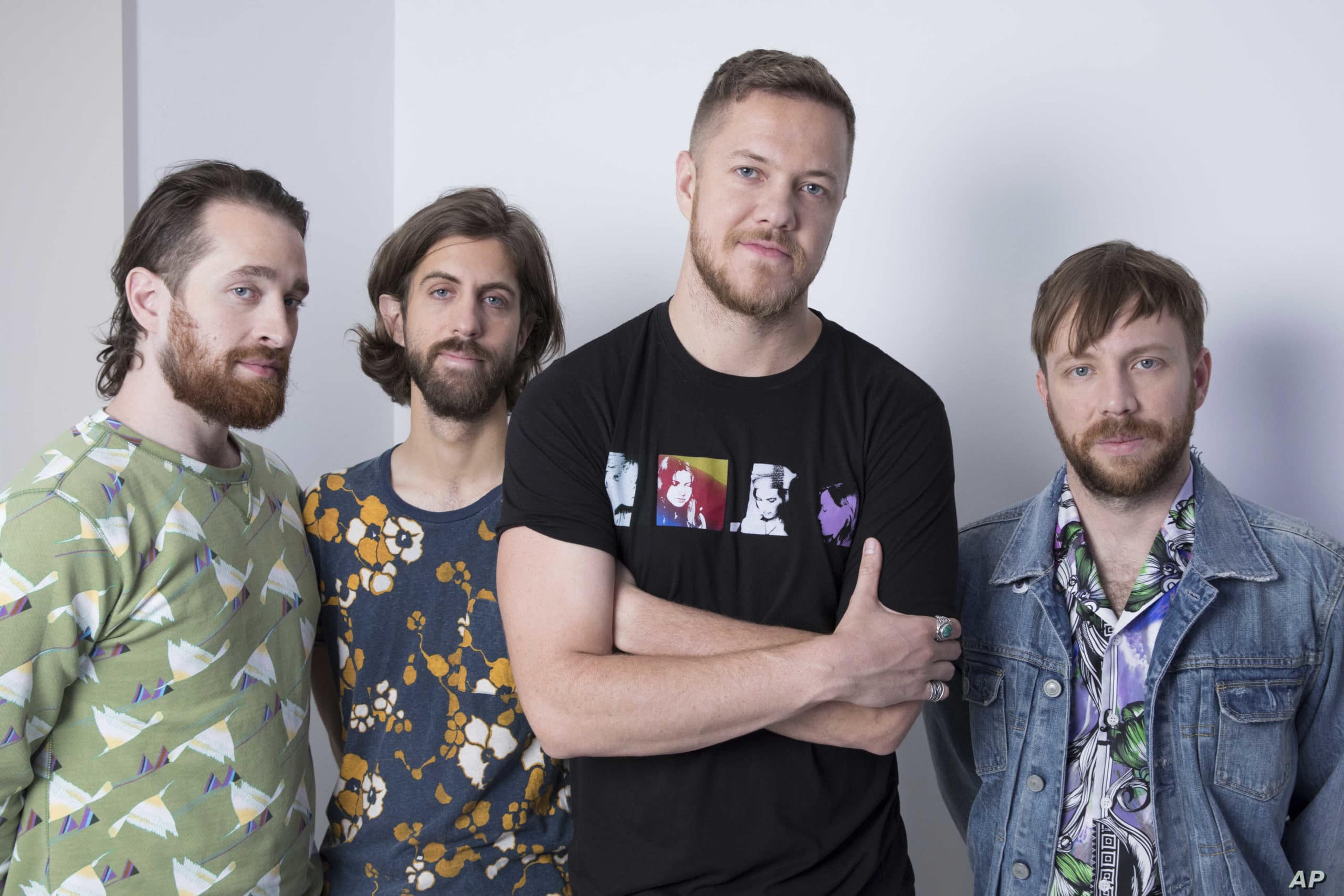 CORRECTS NAME OF BAND MEMBER AT LEFT TO DANIEL PLATZMAN, INSTEAD OF BRITTANY TOLMAN - This June 20, 2017 photo shows members of Imagine Dragons, from left, Daniel Platzman, Wayne Sermon, Dan Reynolds and Ben McKee in New York. (Photo by Amy Sussman/Invision/AP)