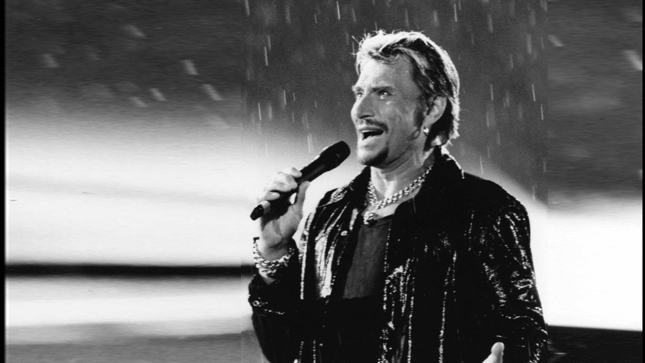 Le 11 septembre 1998, Johnny décidait de chanter sous une pluie diluvienne !