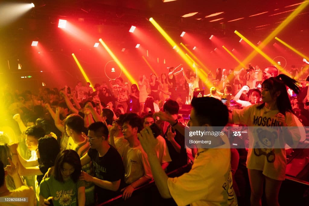 People dance inside the Hepburn nightclub in Wuhan, China, on Friday, Aug. 7, 2020. More than eight months after Covid-19 emerged in the industrial hub of 11 million, Wuhan is, perhaps more emphatically than anywhere else, moving into a post-virus future. Photographer: Yan Cong/Bloomberg via Getty Images